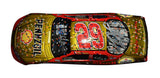 Side view of the autographed 2007 Kevin Harvick #29 Pennzoil Daytona 500 win diecast, featuring the liquid color finish and raced version details. Signed by Harvick and Richard Childress, this diecast is a rare collectible, with only 729 units produced, making it an essential item for diecast collectors.
