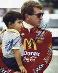 Autographed 8x10 inch NASCAR photo featuring Bill Elliott and Chase Elliott together on pit road in 1998, both signatures clearly visible. The #94 McDonald's race car adds historical depth to this collectible, which comes with a COA. Perfect for fans, collectors, and gifting to racing enthusiasts.