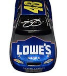 2002 Jimmie Johnson #48 Lowe's Racing rookie season diecast, signed by both Johnson and Chad Knaus. A rare collectible featuring detailed artwork and a Certificate of Authenticity.