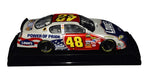 This 1/24 scale NASCAR diecast honors Memorial Day with a patriotic red, white, and blue design. Signed by Jimmie Johnson and Chad Knaus, it includes a COA and features accurate detailing from the 2007 race, making it a meaningful collectible and a thoughtful gift for fans of racing and American pride.