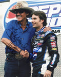 This iconic 2X signed NASCAR photo features Jeff Gordon and Richard Petty during the driver intros at Daytona for the 2007 Pepsi 400. Comes with a Certificate of Authenticity.