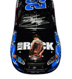 Vintage Tony Stewart and Kevin Harvick dual signed Kid Rock sponsored NASCAR Busch Series diecast car from 2004 shown in 1/24 scale with detailed body graphics, racing sponsorship markings, and included Certificate of Authenticity for collectors.