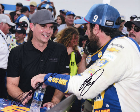 Dual autographed Chase Elliott and Jeff Gordon NAPA Racing pit road photo featuring both drivers standing together with the #9 Hendrick Motorsports team imagery visible. This signed 8x10 NASCAR collectible includes a COA, makes a great gift, and we are always here to help with any questions.