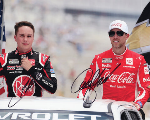 Autographed Denny Hamlin and Christopher Bell 2023 Charlotte driver introductions photo showing both Joe Gibbs Racing drivers standing on stage with Coca-Cola #11 and Rheem #20 branding visible. This dual-signed 8x10 NASCAR collectible includes a COA, makes a great gift, and we are always here to help with any questions.