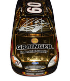 Close-up of the dual signed Greg Biffle and Jack Roush #60 Grainger 24K Gold Team Caliber Owners Series 1/24 scale NASCAR diecast showcasing authentic autographs, brilliant commemorative finish, premium craftsmanship, and an included JSA Certificate of Authenticity.