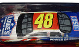 Close-up of the 2003 Jimmie Johnson and Chad Knaus dual signed #48 Lowe's Power of Pride Chase The Race Collector's Series Action 1/24 scale NASCAR diecast with premium detailing and authentic autographs. Includes a Certificate of Authenticity and a rigid, plastic toploader for protection and display.