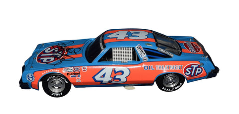 Step back in time with the Autographed 1977 Richard Petty #43 STP Racing Oldsmobile Cutlass Diecast Car, a vintage Franklin Mint collectible showcasing Petty's legacy. COA included.