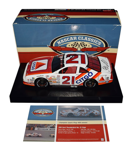 Autographed 1991 Dale Jarrett #21 Citgo Michigan Win Diecast Car - Side View: This captivating angle showcases the authentic signatures of Dale Jarrett and other racing legends, meticulously adorning the sleek body of the #21 Citgo racer. The dynamic detailing and precision craftsmanship bring to life the exhilarating moments of victory at the Michigan Speedway, making it a prized possession for any NASCAR enthusiast or collector.