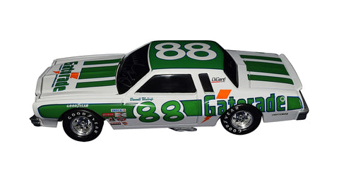 Take a nostalgic journey with the Autographed 1995 Darrell Waltrip #88 Gatorade Racing Vintage Black Window Bank Diecast Car, a limited vintage collectible. Exclusive signatures acquired through special signings and HOT Pass access. Includes Certificate of Authenticity (COA) – an ideal gift for NASCAR fans and collectors.