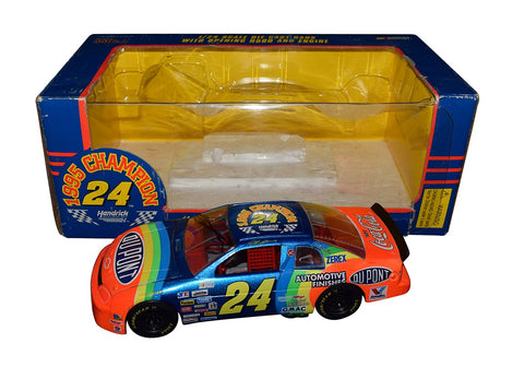 Jeff Gordon #24 DuPont Rainbow NASCAR Champion Diecast Car - Top View: From this aerial perspective, the impeccable craftsmanship and attention to detail of the Jeff Gordon #24 DuPont Rainbow Diecast Car are on full display. The vibrant colors of the iconic rainbow paint scheme, combined with the precise replica of Gordon's championship-winning vehicle, make this collectible a standout addition to any NASCAR memorabilia collection.