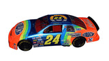 Signed Lionel 1/24 Scale Jeff Gordon #24 DuPont Rainbow Diecast Car - Front View: This front view of the Jeff Gordon #24 DuPont Rainbow Diecast Car captures the essence of speed and competition that defined Gordon's championship season. The lifelike representation of the car's front end, complete with detailed headlights, grille, and sponsor decals, pays homage to Gordon's dominance on the track.