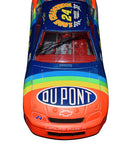 Autographed 1995 Jeff Gordon #24 DuPont Rainbow Diecast Car - Side View: This captivating angle showcases the authentic signatures of Jeff Gordon and other racing legends adorning the sleek body of the #24 DuPont Rainbow car. The meticulous detailing, including sponsor logos and race markings, vividly brings to life Gordon's championship-winning ride.