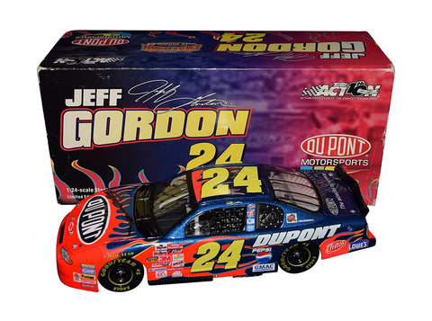 Autographed 2002 Jeff Gordon #24 DuPont Flames Racing Vintage Diecast Car - Side View: Jeff Gordon's signature adorns the sleek body of this vintage racer, featuring fiery flames design reminiscent of his iconic Monte Carlo.