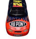 Signed Action 1/24 Scale Jeff Gordon #24 DuPont Flames Racing Vintage Diecast Car - Front View: Feel the thrill of speed with Jeff Gordon's signature prominently displayed on the front of this vintage collectible, capturing the essence of NASCAR excitement.