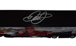 Exclusive Public/Private Signings and HOT Passes Access Description: A glimpse of the autograph acquisition process, showing Dale Earnhardt Jr. signing the collectible hauler during an exclusive public/private signing event with HOT Passes access.