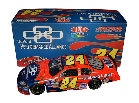 Autographed 2005 Jeff Gordon #24 DuPont Blue Flames Performance Alliance Diecast Car - Side View: Authentic signatures adorn the sleek body of this iconic racer, featuring vibrant blue flames that symbolize speed and power.