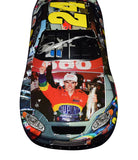 Close-up view of the Autographed 2005 Jeff Gordon #24 DuPont Racing MILESTONES Diecast Car, showcasing Jeff Gordon's signature, a symbol of authenticity and racing history.