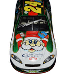 Signed 1/24 Scale Jeff Gordon #24 Christmas Santa Car Diecast - Front View: Feel the holiday spirit with Jeff Gordon's signature prominently displayed on the front of this festive collectible, capturing the essence of racing-inspired holiday joy.