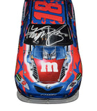 Custom-Made Autographed Kyle Busch M&Ms Racing TRANSFORMERS Diecast Car Description: High-quality image showcasing the custom-made autographed Kyle Busch #18 M&Ms Racing TRANSFORMERS diecast car, celebrating the thrilling partnership between racing and TRANSFORMERS. A one-of-a-kind collectible for NASCAR and TRANSFORMERS fans.