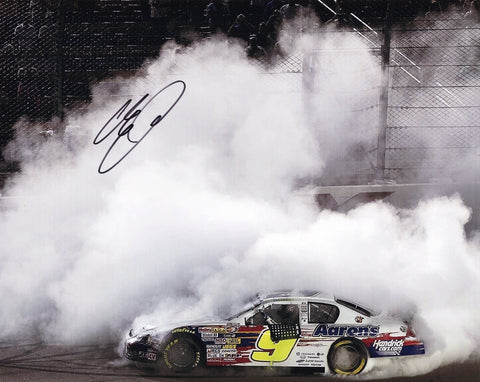 This signed 8x10 inch photo captures Chase Elliott's first victory burnout at the 2012 Iowa Speedway K&N Pro Series race. A must-have collectible for NASCAR fans with a COA.