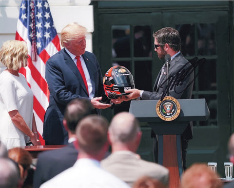 Capture the historic moment with this authentic autographed 8x10 inch NASCAR photo of Martin Truex Jr. celebrating his championship at The White House with President Donald Trump. Certificate of Authenticity included.