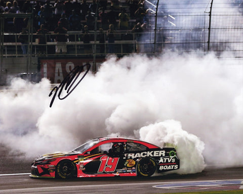 Elevate your collection with this authentic Martin Truex Jr. autographed 8x10 inch NASCAR photo, showcasing his triumphant moment with the victory burnout at Las Vegas. Limited availability – act fast!