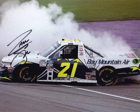 Celebrate Zane Smith's 1st Truck Win with this genuine autographed 8x10 inch NASCAR photo, capturing his exhilarating burnout celebration at Michigan. Authenticated signatures, Certificate of Authenticity, and 100% lifetime guarantee included.