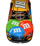 Experience the excitement of NASCAR with the Autographed 2021 Kyle Busch #18 M&M's Toyota 30th Anniversary Diecast Car, a limited edition #1183 of 1,548, featuring exclusive signatures acquired through exclusive public/private signings and HOT Pass garage access. It comes with a Certificate of Authenticity (COA) – perfect for NASCAR fans and collectors.