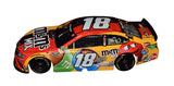 Limited Edition Kyle Busch #18 M&M's Mix Toyota 30TH ANNIVERSARY Diecast Car Description: An exciting close-up view of the limited-edition Kyle Busch #18 M&M's Mix Toyota 30TH ANNIVERSARY diecast car, featuring vibrant colors and commemorative graphics. Autographed by Kyle Busch, a must-have for collectors.