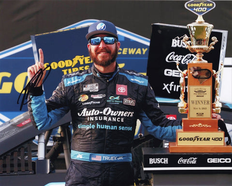 Own a piece of racing history with this authentic autographed 8x10 inch NASCAR photo of Martin Truex Jr. celebrating his 2021 Darlington win with the Victory Lane Trophy. Certificate of Authenticity included.