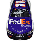 Own a piece of NASCAR history with the Autographed 2022 Denny Hamlin #11 FedEx Express Racing Diecast Car, a limited edition #0574 of 1,008, featuring exclusive signatures acquired through exclusive public/private signings and HOT Pass garage access. It comes with a Certificate of Authenticity (COA) – perfect for NASCAR fans and collectors.