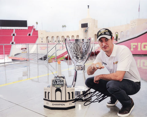 Relive the thrill of Joey Logano's 2022 NASCAR Championship with the AUTOGRAPHED #22 Pennzoil Racing NASCAR CHAMPION Signed 8x10 Inch Picture. This iconic photo showcases Logano's triumphant moment, surrounded by championship trophies at the LA Coliseum.