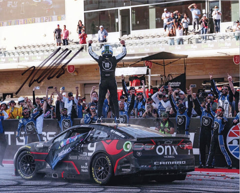 Celebrate Ross Chastain's thrilling victory at the 2022 COTA RACE WIN with this autographed 8x10 inch NASCAR photo. Witness the joyous victory celebration, captured in detail. Each signature is guaranteed authentic, and it comes with a Certificate of Authenticity.