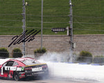 Autographed 2022 Ross Chastain #1 Trackhouse HAUL THE WALL NASCAR Photo with COA - Side view of the photo showcasing Chastain's victory celebration.