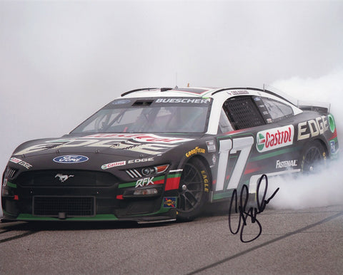 Relish the excitement of Chris Buescher's historic victory and exhilarating burnout at Michigan with this AUTOGRAPHED Chris Buescher #17 Castrol MICHIGAN WIN (Burnout) Photo from 2023. Each signature is a symbol of authenticity, acquired through exclusive public/private signings and HOT Pass garage access. Your purchase includes a Certificate of Authenticity, solidifying its genuine nature. 