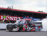 This autographed 2023 Corey Heim Mid-Ohio race win photo captures the thrilling burnout after his victory in the Craftsman Truck Series. The 9x11 glossy image is signed and includes a Certificate of Authenticity (COA), making it a valuable collectible for fans.