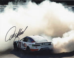 Autographed Denny Hamlin #11 FedEx Racing Kansas Race Win NASCAR photo capturing the thrilling Victory Burnout moment. Limited edition collectible with genuine signature and Certificate of Authenticity. A must-have for NASCAR enthusiasts.