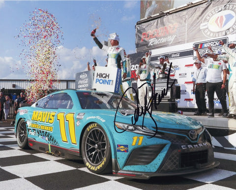 Capture the euphoria of Denny Hamlin's monumental victory at the 2023 Pocono Win with the AUTOGRAPHED 8x10 Inch NASCAR Photo. This iconic image showcases Hamlin in Victory Lane, surrounded by a cascade of celebratory confetti. Our commitment to authenticity is unwavering; each signature is meticulously obtained through exclusive public/private signings and exclusive garage area access via HOT Passes.