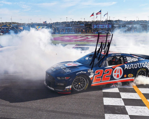 Own a piece of NASCAR history with the AUTOGRAPHED 2023 Joey Logano #22 Auto Trader ATLANTA WIN Signed 8x10 Inch Picture. This exclusive photo captures Logano's triumphant moment, executing a victory burnout at Atlanta Motor Speedway.