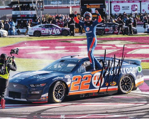 Relive the electrifying moment with the AUTOGRAPHED 2023 Joey Logano #22 Auto Trader ATLANTA WIN Signed 8x10 Inch Picture. This captivating photo captures Logano's victory celebration at Atlanta Motor Speedway, ensuring its authenticity with authenticated signatures. 