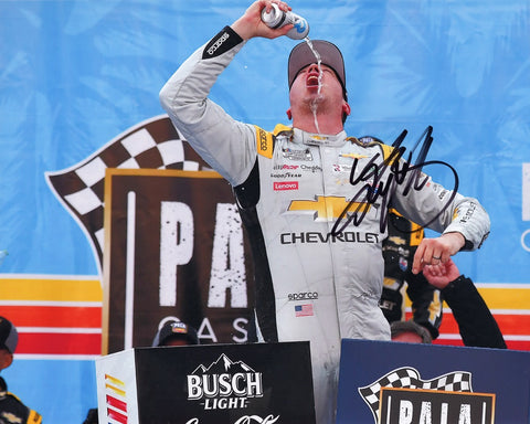 Celebrate in style with an authentic Kyle Busch autographed 2023 Lucas Oil Racing CALIFORNIA WIN (Victory Lane Chug) 8x10 photo. This collector's gem, complete with a Certificate of Authenticity, vividly captures the euphoria of the post-race Victory Lane chug.