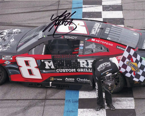 Relive the electrifying moment of victory with an authentic Kyle Busch autographed 2023 McLaren Grills TALLADEGA WIN (Checkered Flag Bow) 8x10 photo. This collector's gem, complete with a Certificate of Authenticity, beautifully captures the thrilling checkered flag bow.