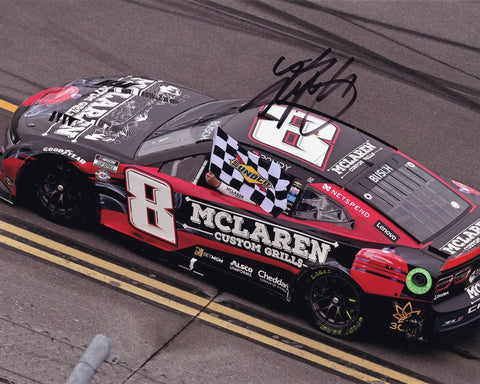 Capture the excitement of victory with an authentic Kyle Busch autographed 2023 McLaren Grills TALLADEGA WIN (Polish Victory Lap) 8x10 photo. This collector's gem, complete with a Certificate of Authenticity, vividly captures the thrilling moment of Busch's signature victory lap.