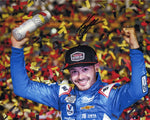 Immerse yourself in the excitement of Kyle Larson's 2023 Cookout Southern 500 victory with this autographed 8x10 inch NASCAR photo, showcasing the confetti-filled euphoria of victory lane celebrations.