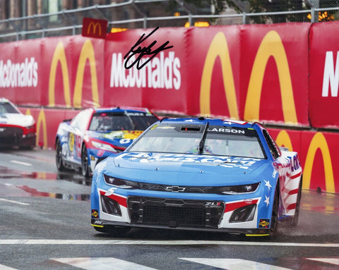 Rev up your collection with an AUTOGRAPHED 2023 Kyle Larson #5 Hendrick Patriotic Racing 8x10 Photo, capturing the thrill of the Chicago Street Race.