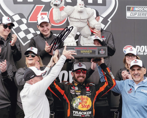 Experience the excitement of Martin Truex Jr.'s #19 Bass Pro Shops DOVER WIN with this signed NASCAR photo featuring the Monster Mile Trophy.