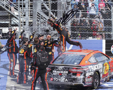 Celebrate Martin Truex Jr.'s victory with this autographed 8x10 inch photo featuring the #19 Bass Pro Shops car and his victorious crew.