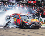 Autographed 2023 Martin Truex Jr. #19 Bass Pro Shops SONOMA WIN (Victory Burnout) Signed 8x10 Inch NASCAR Photo with COA - A thrilling moment frozen in time, this autographed photo captures Martin Truex Jr.'s triumphant victory burnout at Sonoma, showcasing his skill and determination on the track. Perfect for NASCAR fans and collectors alike, each signature is obtained through exclusive signings, ensuring authenticity and value.