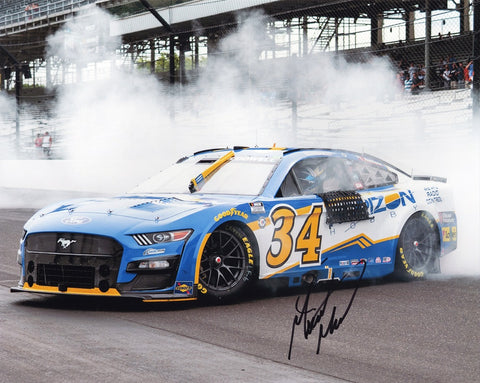 Authentic Michael McDowell #34 autographed NASCAR photo celebrating his Horizon Hobby INDY ROAD COURSE WIN.