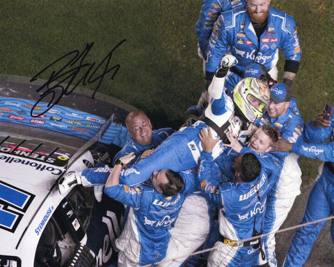 Own a piece of racing history with this autographed 8x10 inch NASCAR photo featuring Ricky Stenhouse Jr.'s exhilarating Daytona 500 victory celebration. Ideal for gifting or adding to your own collection. Limited inventory available – don't wait!
